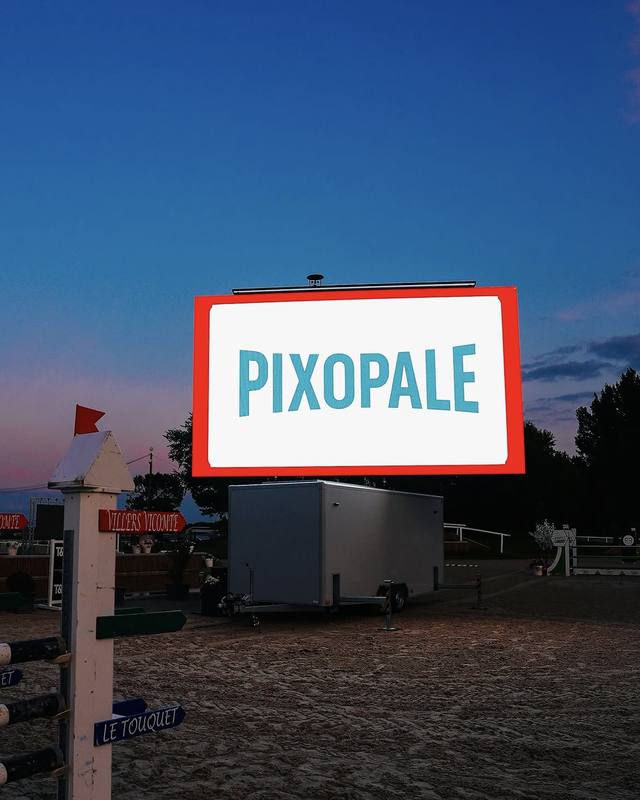 Pixopale XL screen lit up at nightfall in an arena