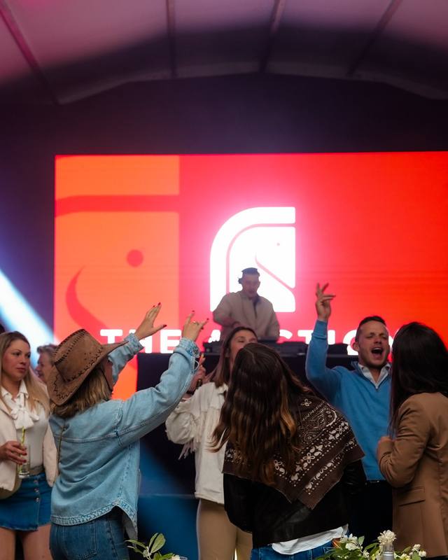 Dance floor in front of the screen in a marquee